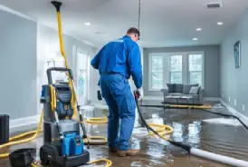 a lady wiping water on the floor